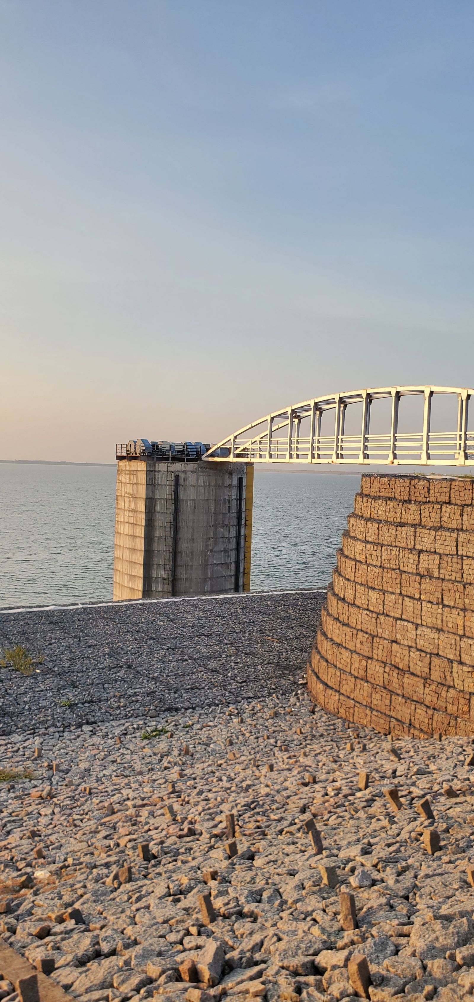 Intake tower and arched access bridge at Kondapochamma Sagar