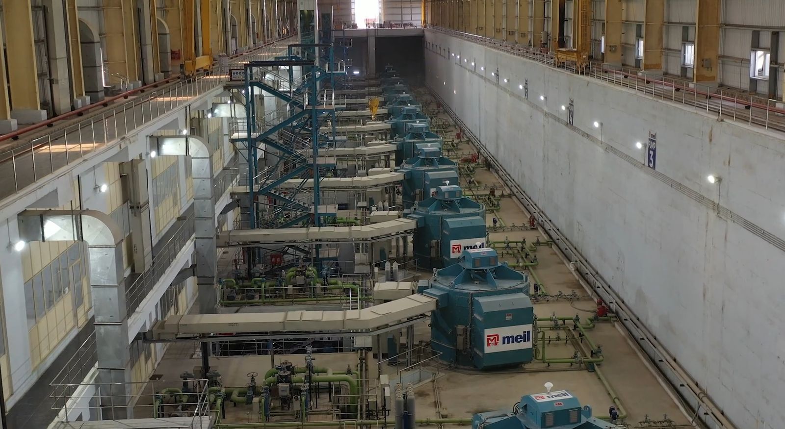 Inside the pump hall: a row of pump and motor units